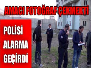 Fotoğraf çekmek için yüksek binanın tepesine çıkan genç, polisi alarma geçirdi 